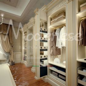 luxury custom walk in closets with retractable compartments enriched with gold finishes