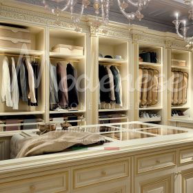High quality walk-in closets with equipped wall enriched with precious golden columns